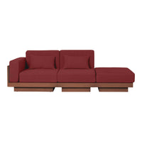 Deep red fabric sectional sofa with a sleek wooden base; modern design with clean lines and minimalistic style.