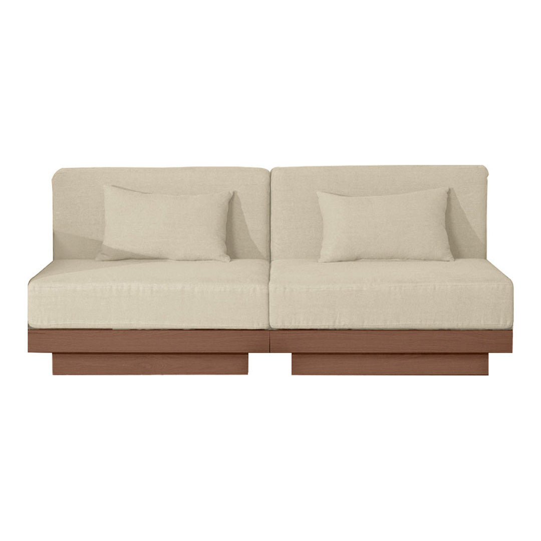Beige fabric sofa with clean lines and a wooden base, featuring subtle textures and two contrasting pillows.