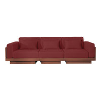 Stylish deep red sofa with plush cushions and smooth wooden base, perfect for modern living spaces.