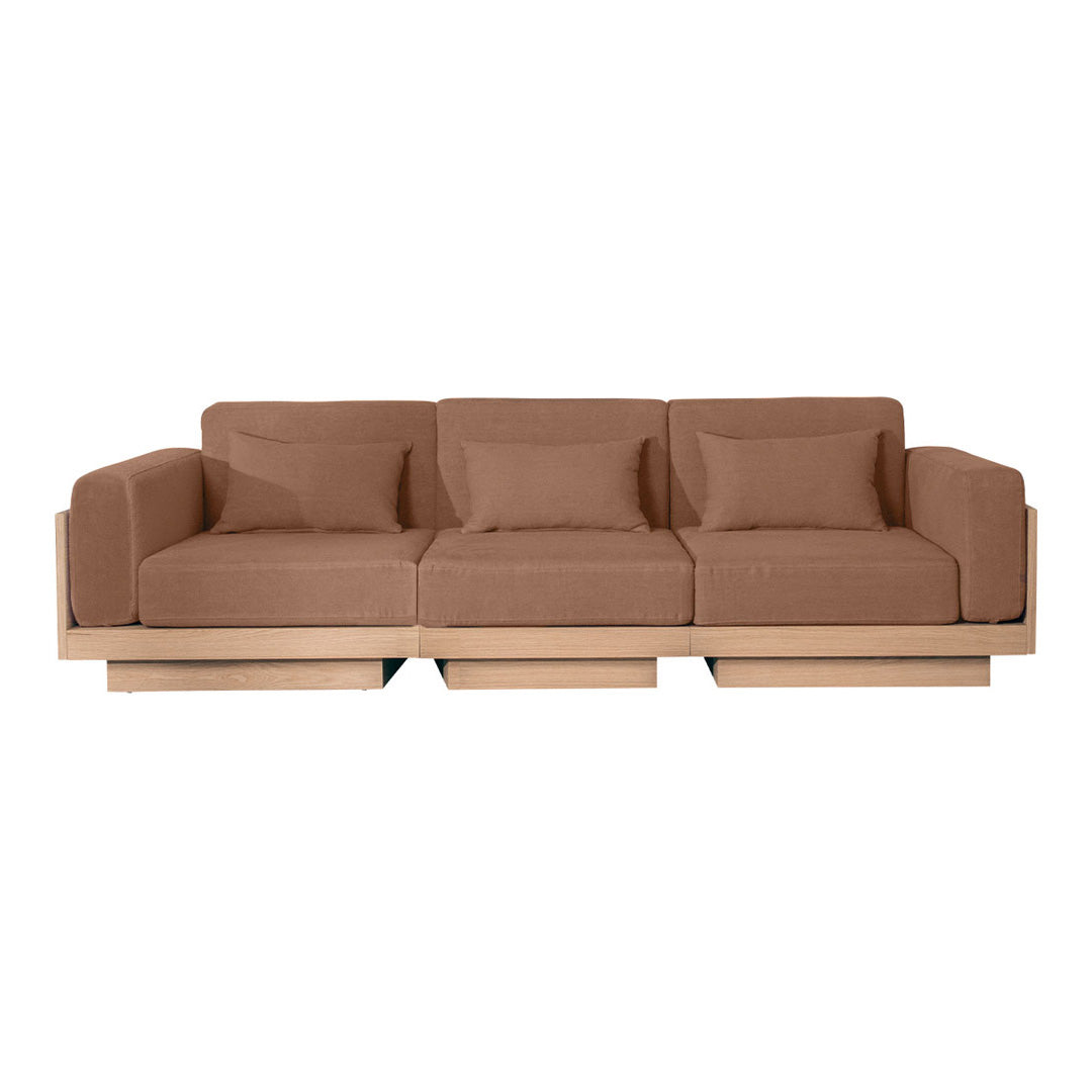 Brown upholstered sofa with matching pillows, featuring a minimalist design and wooden base.