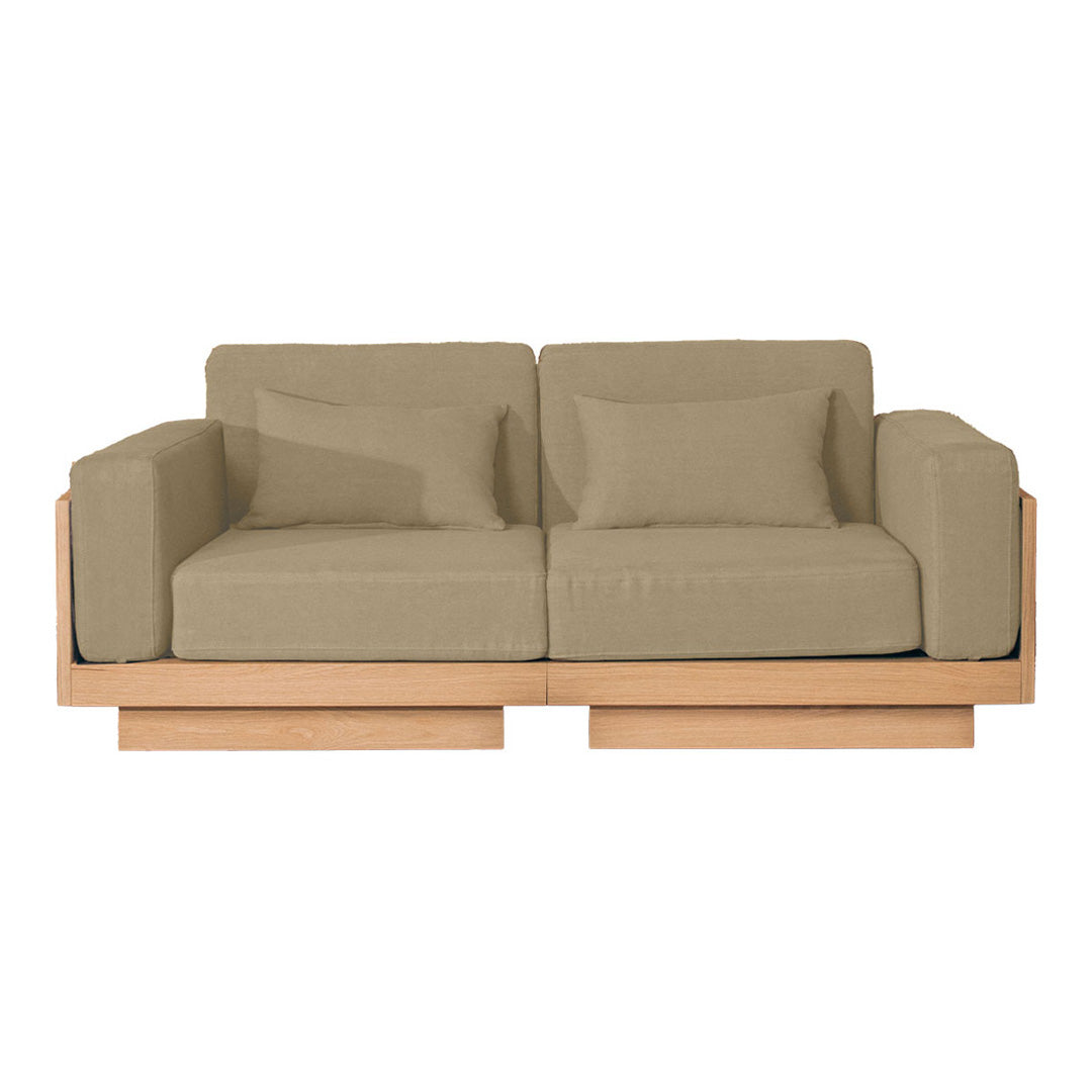 Beige upholstered sofa with clean lines and wooden base, featuring solid color cushions. Perfect for modern decor.