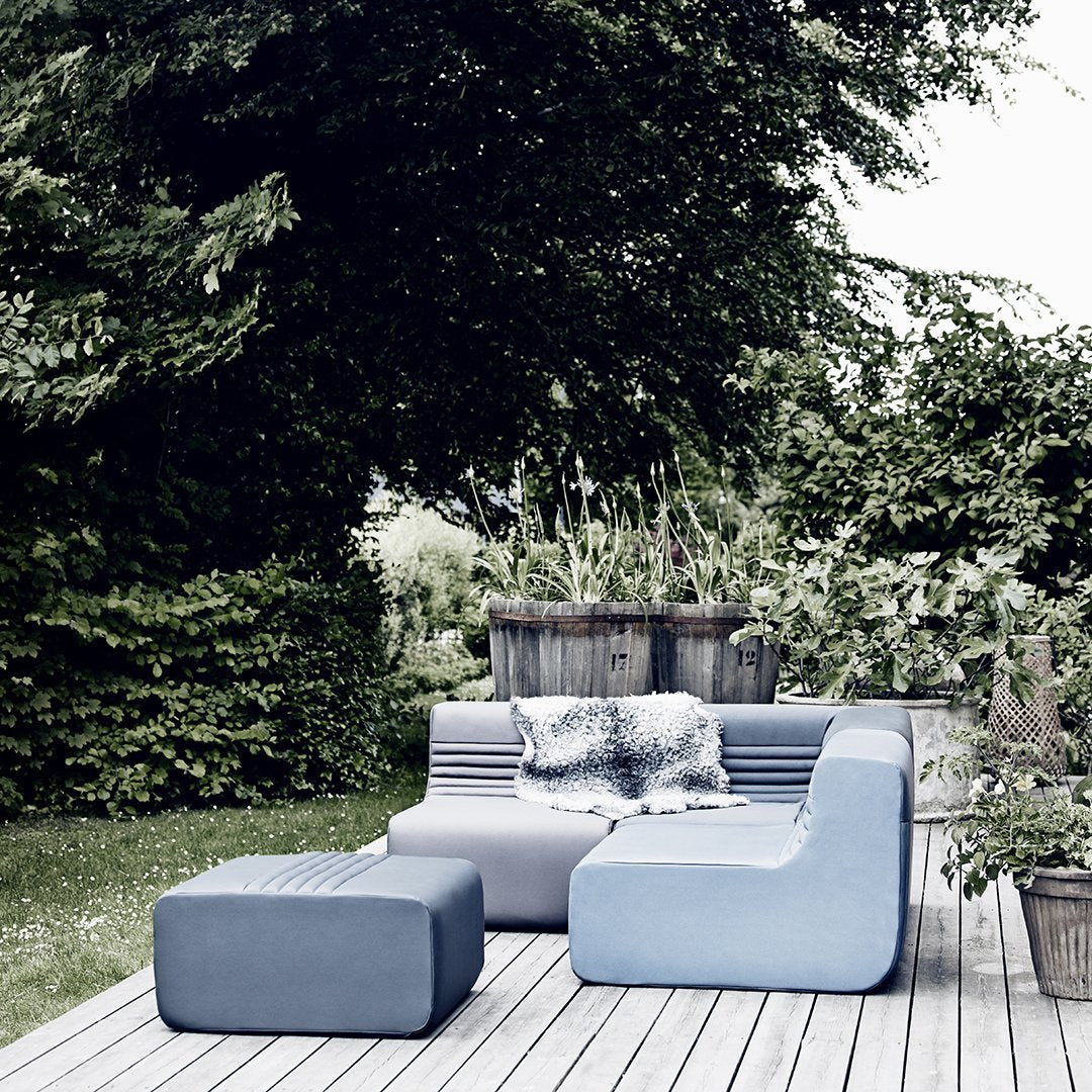 Modern outdoor seating in varying shades of blue, featuring sleek lines and a contemporary design.