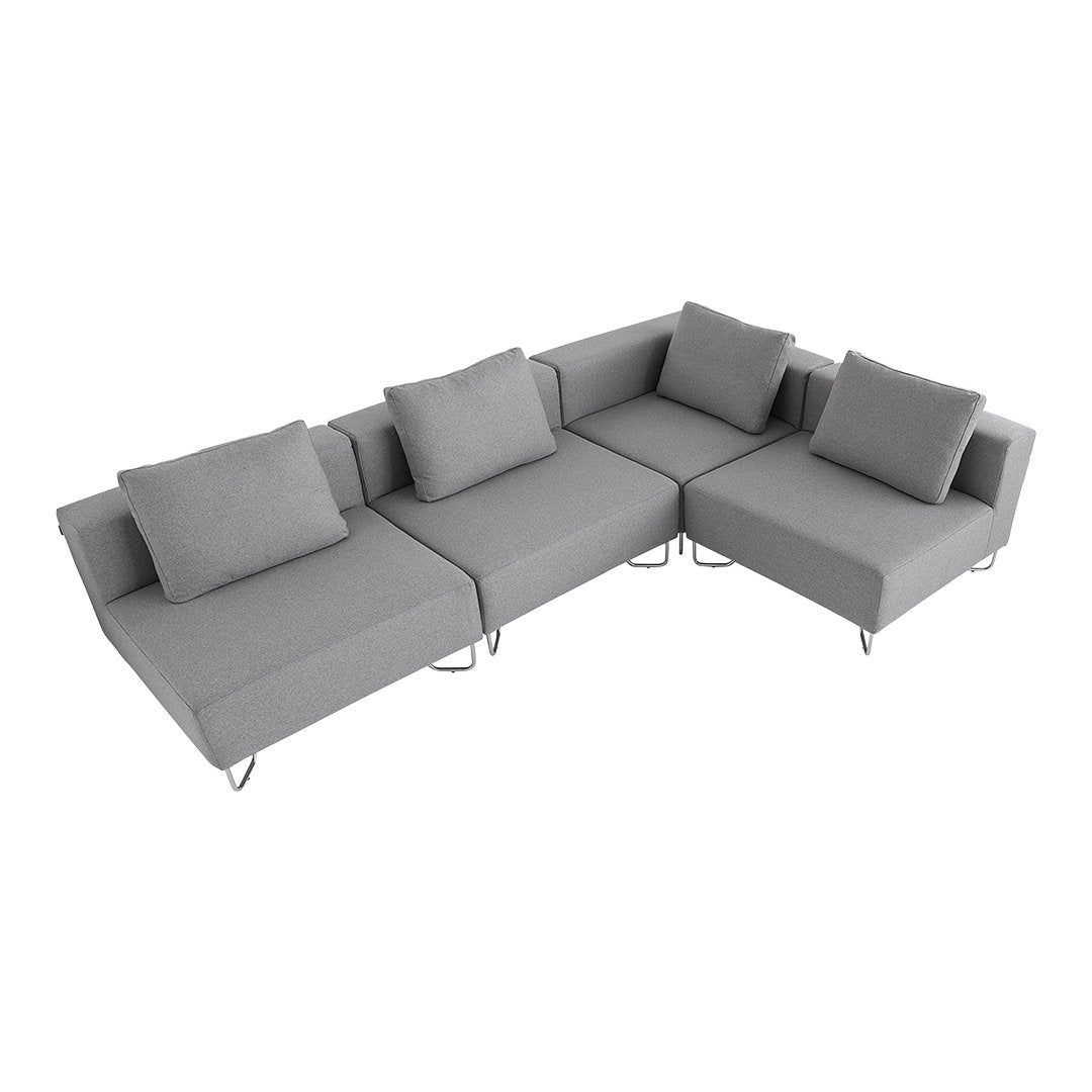 Modern gray sectional sofa with smooth fabric and plush cushions, featuring minimalist design and sleek silver legs.