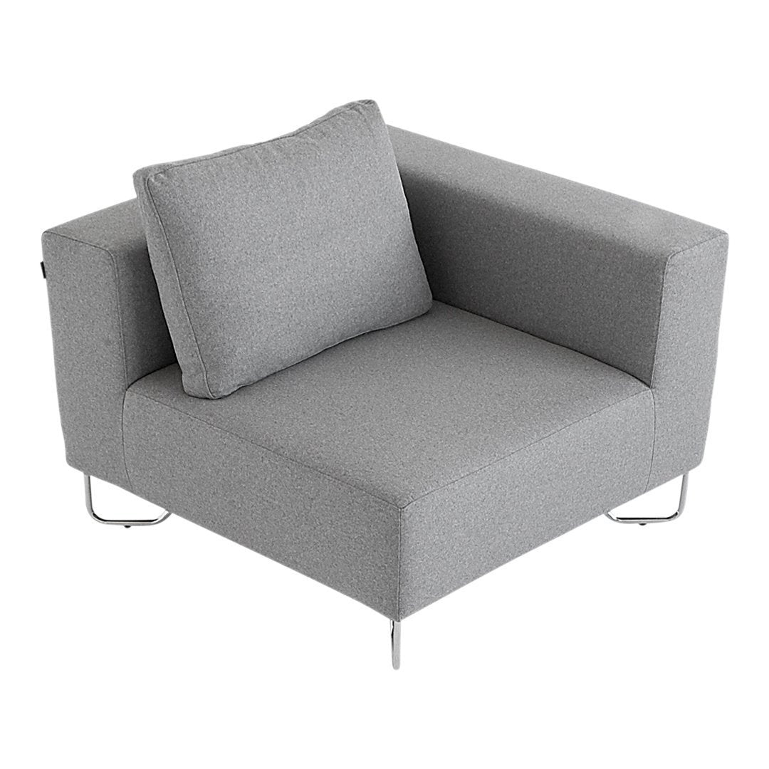 Gray fabric armchair with a minimalist design and a matching square pillow. Ideal for modern living spaces.