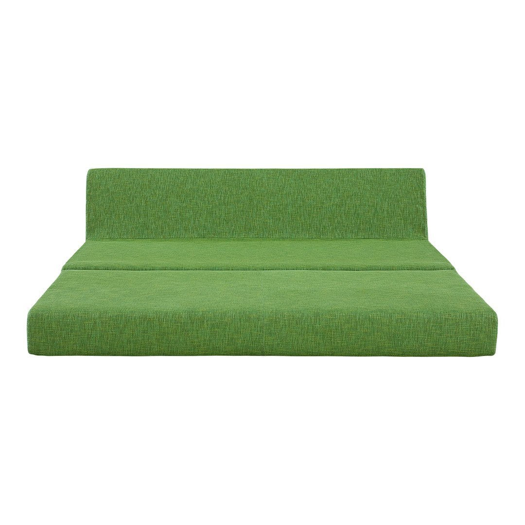 "Vibrant green sofa with a textured pattern, perfect for modern living spaces."