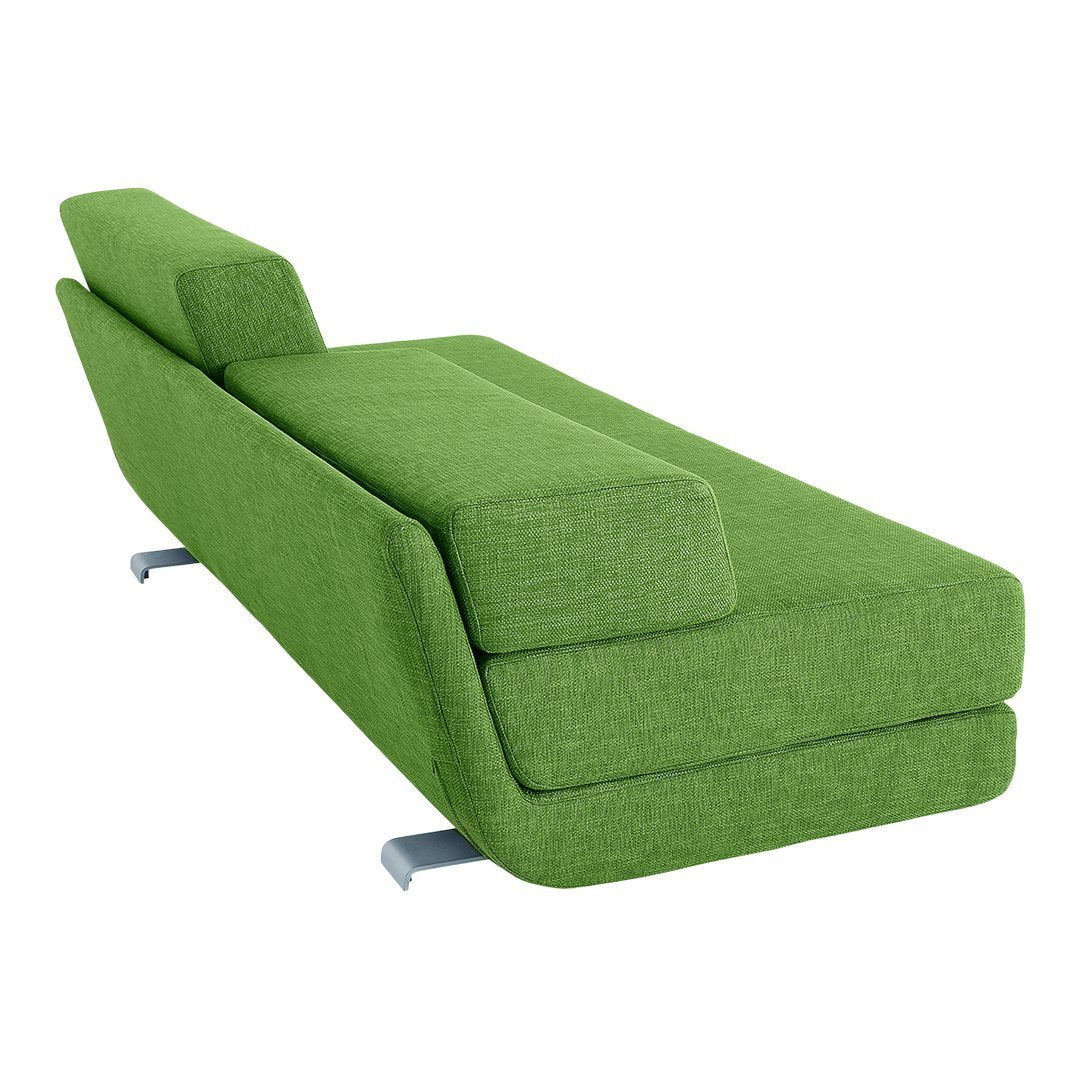 Vibrant green chaise lounge with a modern, sleek design and smooth fabric texture. Perfect for contemporary spaces.