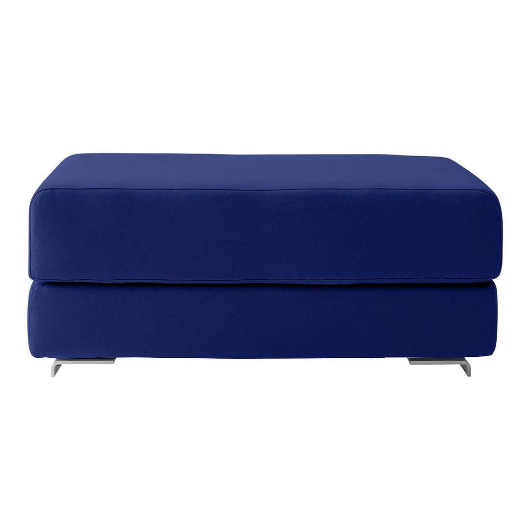 Navy blue upholstered ottoman with a sleek, solid design and modern silver legs. Perfect for any contemporary space.