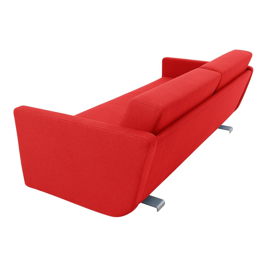 Bright red modern sofa with a sleek, minimalist design and chrome legs, perfect for contemporary decor.