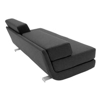 Gray upholstered chaise lounge with a sleek, minimalist design and subtle texture. Modern silver legs elevate the look.