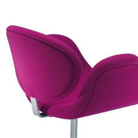 Fuchsia upholstered chair with smooth curves and sleek silver base, perfect for modern decor.