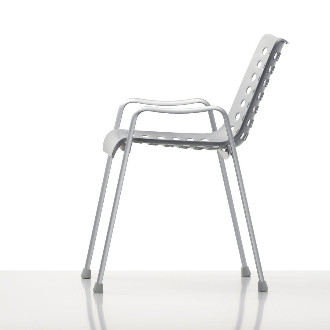 Gray ergonomic chair with a sleek design and perforated backrest for optimal ventilation and style.