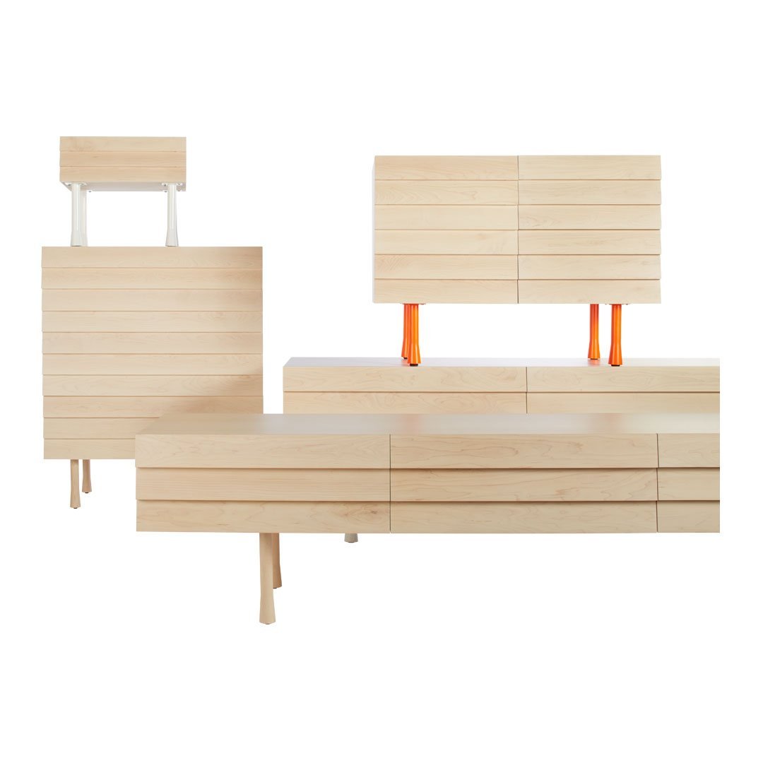 Light wood furniture set with sleek lines, minimalist design, and vibrant orange accents.