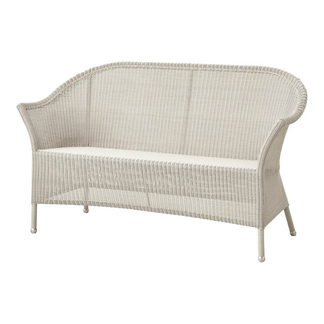 White wicker sofa with smooth, woven texture and a minimalist design, perfect for outdoor or indoor relaxation.