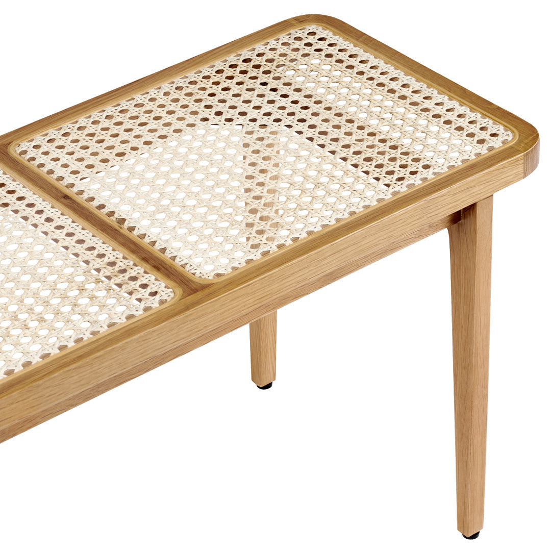 Natural wood coffee table with a woven cane pattern, featuring light beige and tan colors. Elegant and modern design.