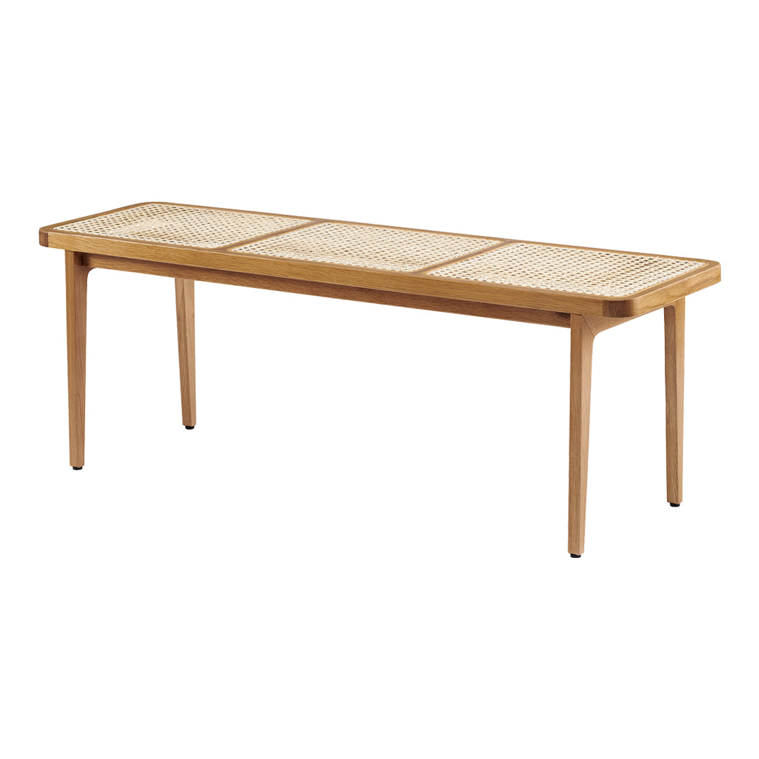 Natural wood coffee table with a minimalist design and woven cane pattern on the surface, perfect for modern decor.