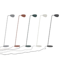 Modern floor lamps in shades of gray, white, green, brown, and black, featuring sleek, minimalist designs.
