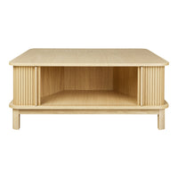 Light oak coffee table with a smooth top and ribbed sides, showcasing natural wood grain patterns.