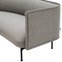 Grey upholstered sofa with subtle textured pattern and sleek black metal legs. Minimalist design for modern interiors.