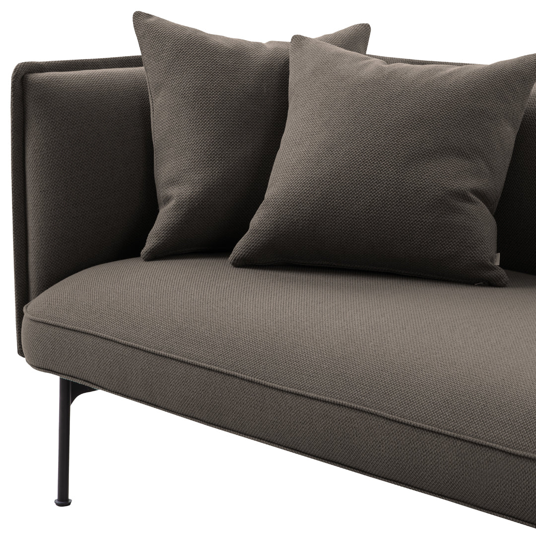 Gray sofa with matching throw pillows, featuring a smooth fabric texture and sleek modern design. Perfect for contemporary decor.