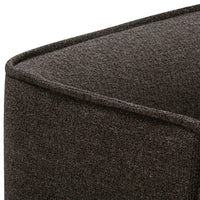 Brown textured fabric with a subtle weave pattern on a cushioned surface. Ideal for stylish home décor.