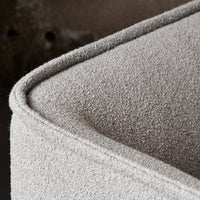 Textured light gray fabric with a soft, subtle pattern, showcasing a modern, minimalist design.
