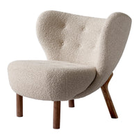 Cream-colored chair with a textured, fluffy upholstery and wooden legs. Elegant mid-century modern design.