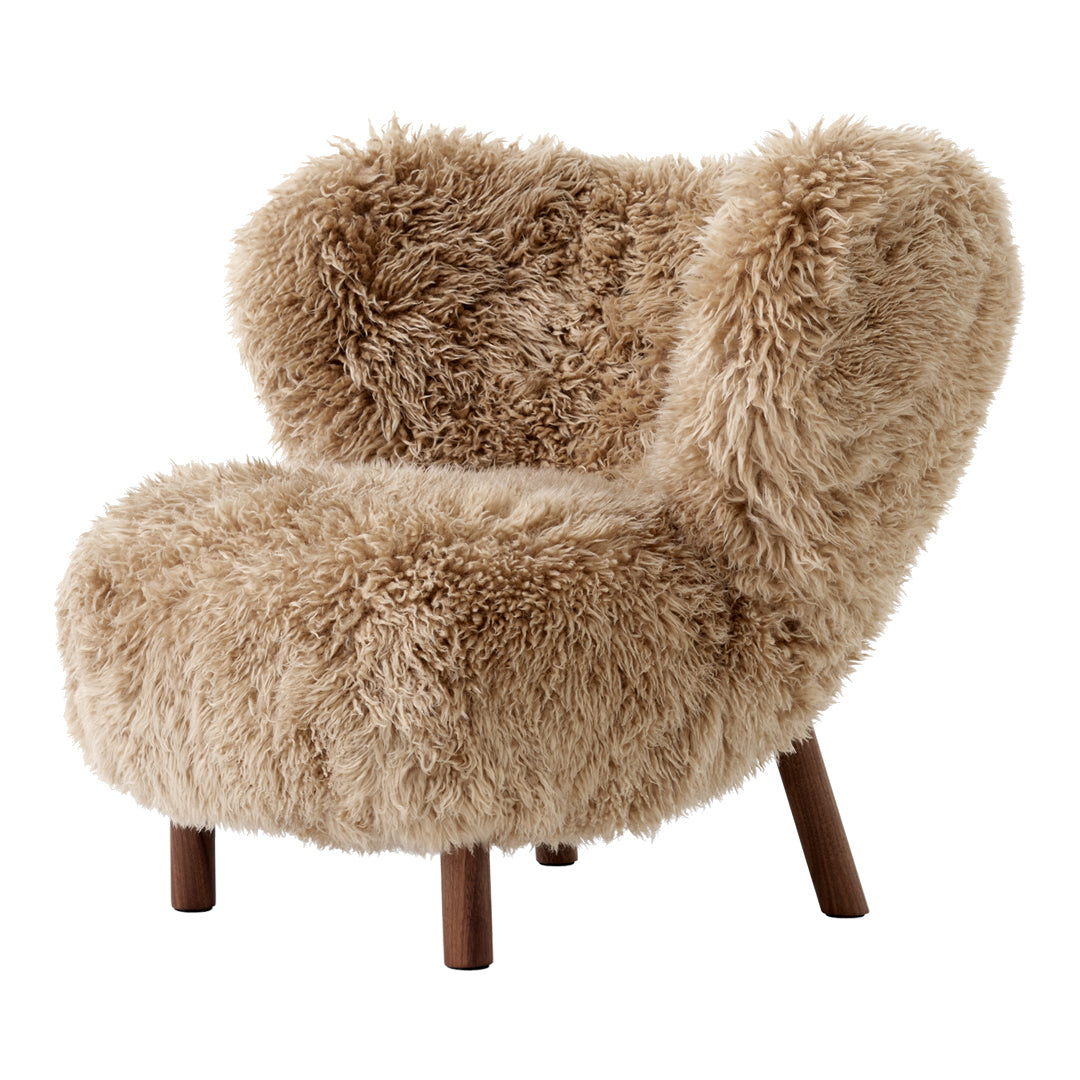 Fluffy beige faux fur chair with curved silhouette and wooden legs, perfect for cozy, stylish seating.