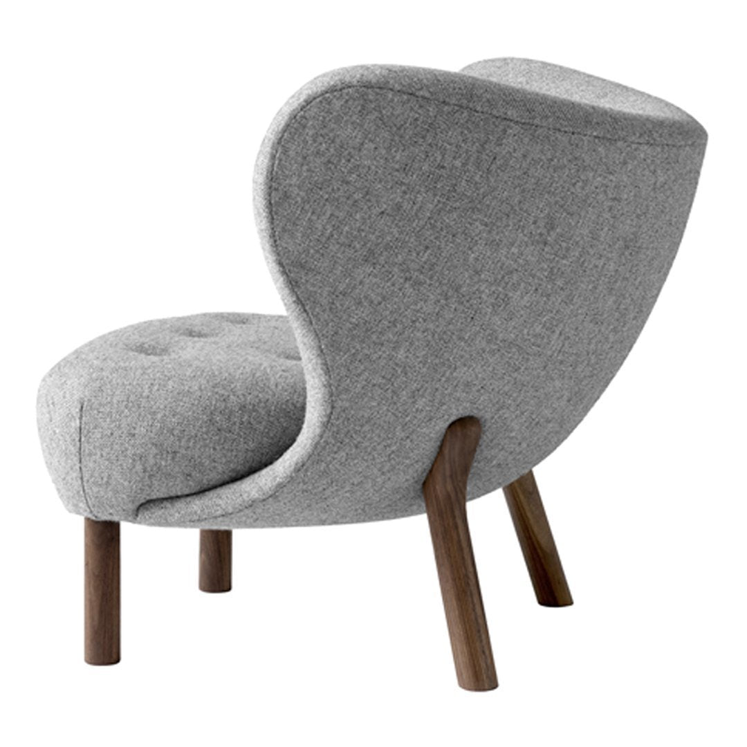 Gray upholstered chair with a smooth, modern design and wood legs, featuring a subtle tufted pattern.