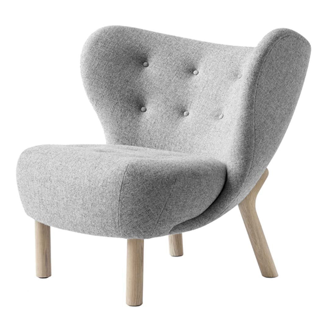 Gray upholstered chair with a minimalist design, featuring decorative buttons and natural wooden legs.