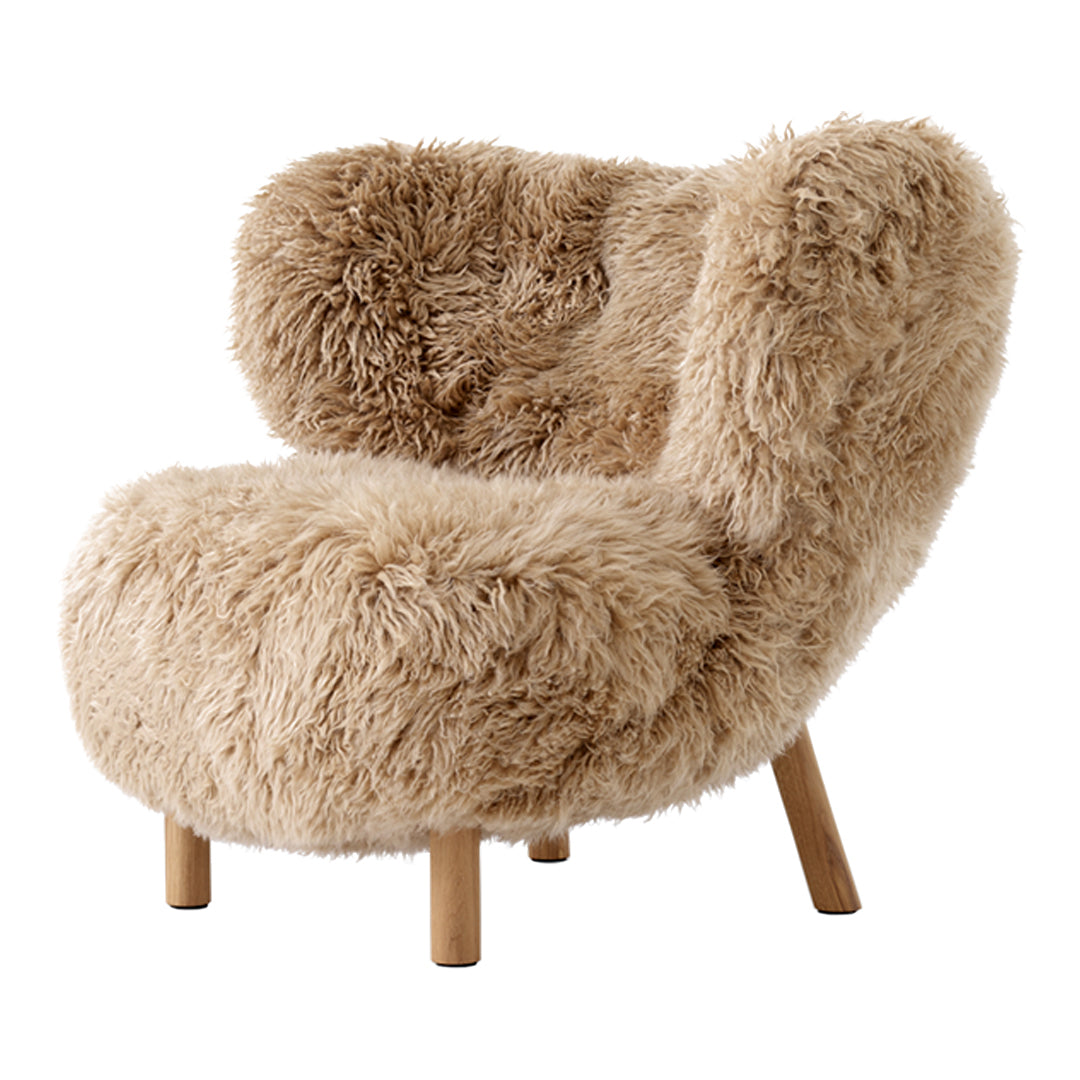Cozy beige faux fur chair with a textured, fluffy pattern and light wooden legs for a warm touch.