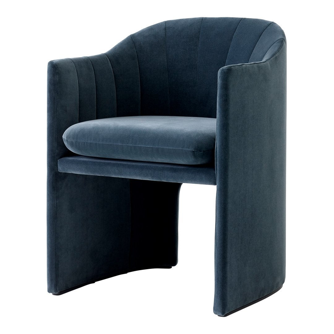 Dark teal upholstered chair with vertical ribbed pattern and sleek, modern design. Ideal for stylish interiors.