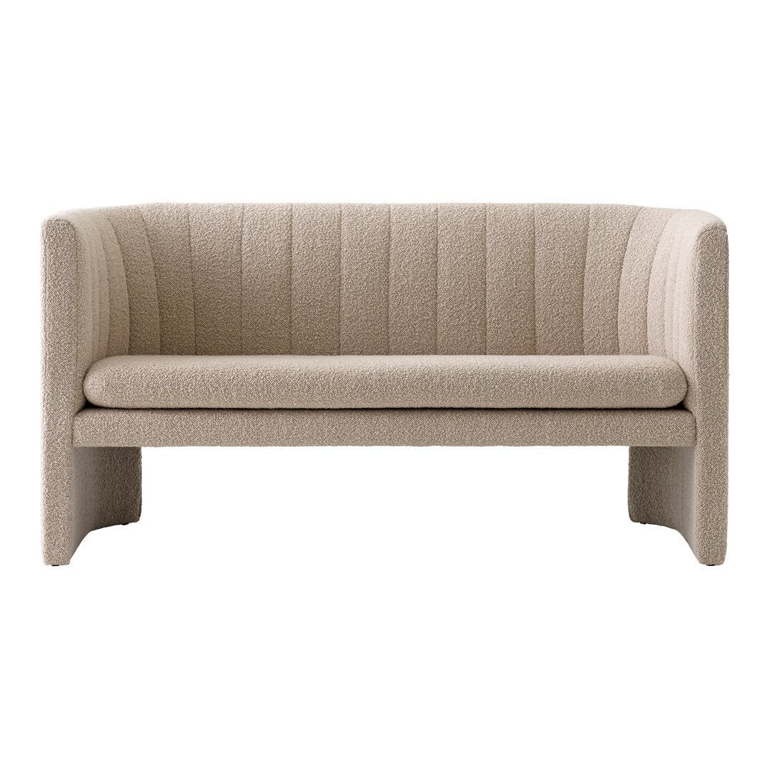 Beige upholstered sofa with vertical ribbed pattern and modern design. Ideal for minimalist and contemporary decor.