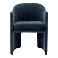 Velvet armchair in deep navy blue with elegant curved lines and a smooth, plush texture.