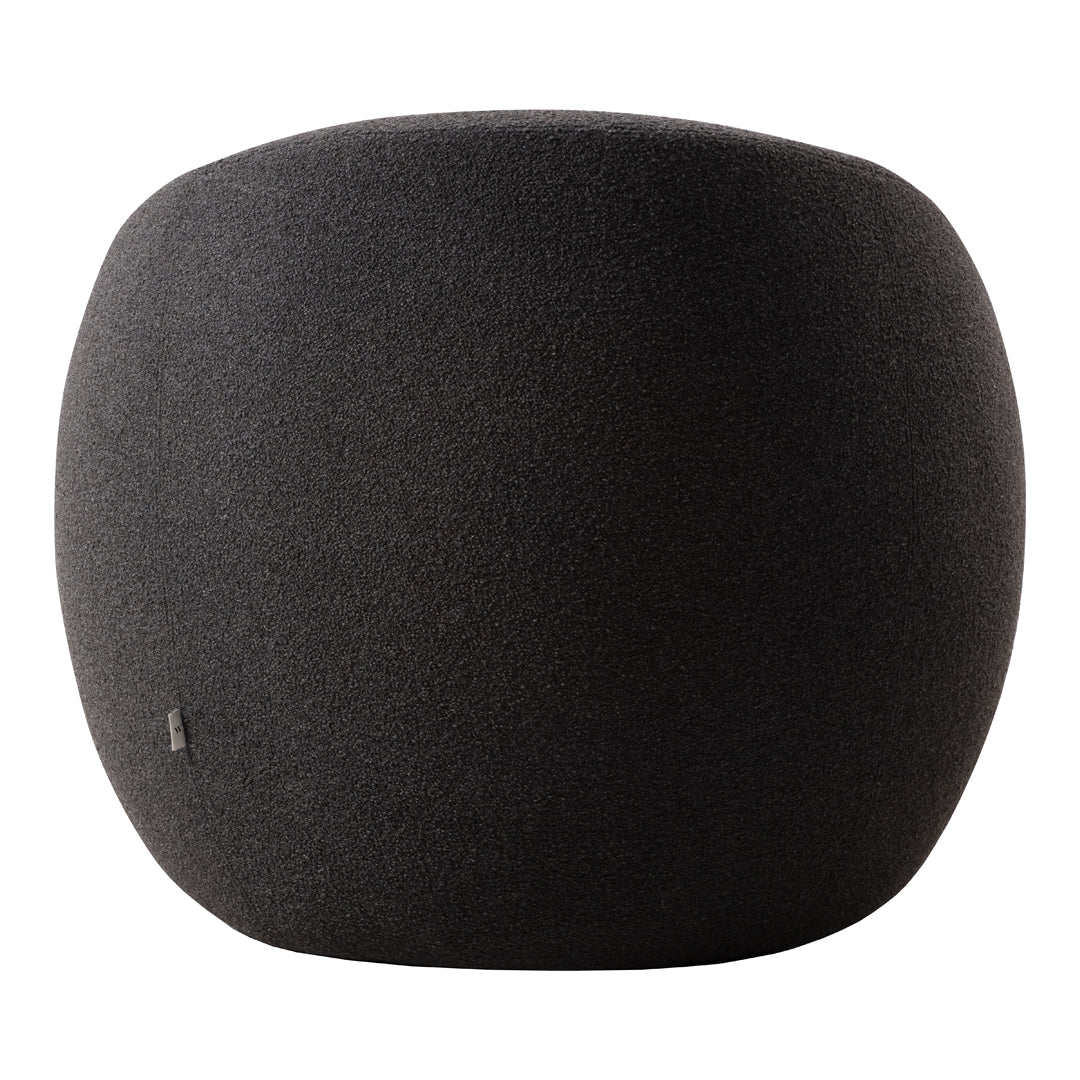 Sleek black rounded ottoman, featuring a smooth, textured surface with a modern aesthetic.