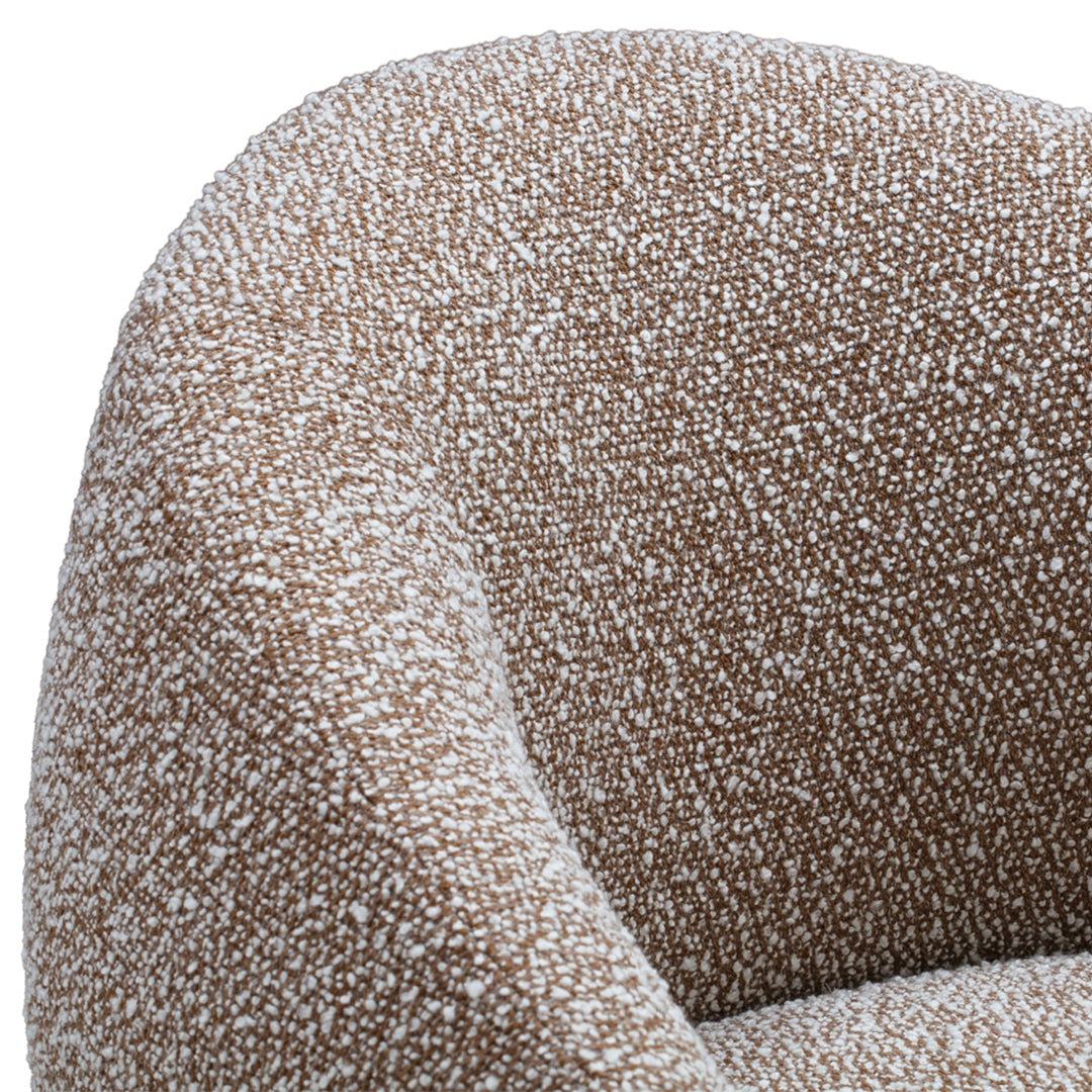 Brown textured fabric with a speckled white pattern, featuring a soft, rounded armrest design.