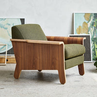 "Modern chair featuring a green textured upholstery and rich wood grain accents for a stylish, earthy appeal."
