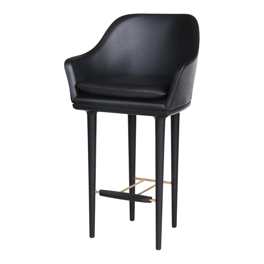 Stylish black leather bar stool with sleek black legs and gold footrest accents, perfect for modern decor.