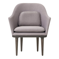 Lavender accent chair with smooth upholstery and dark wooden legs, featuring a minimalist design and soft curves.