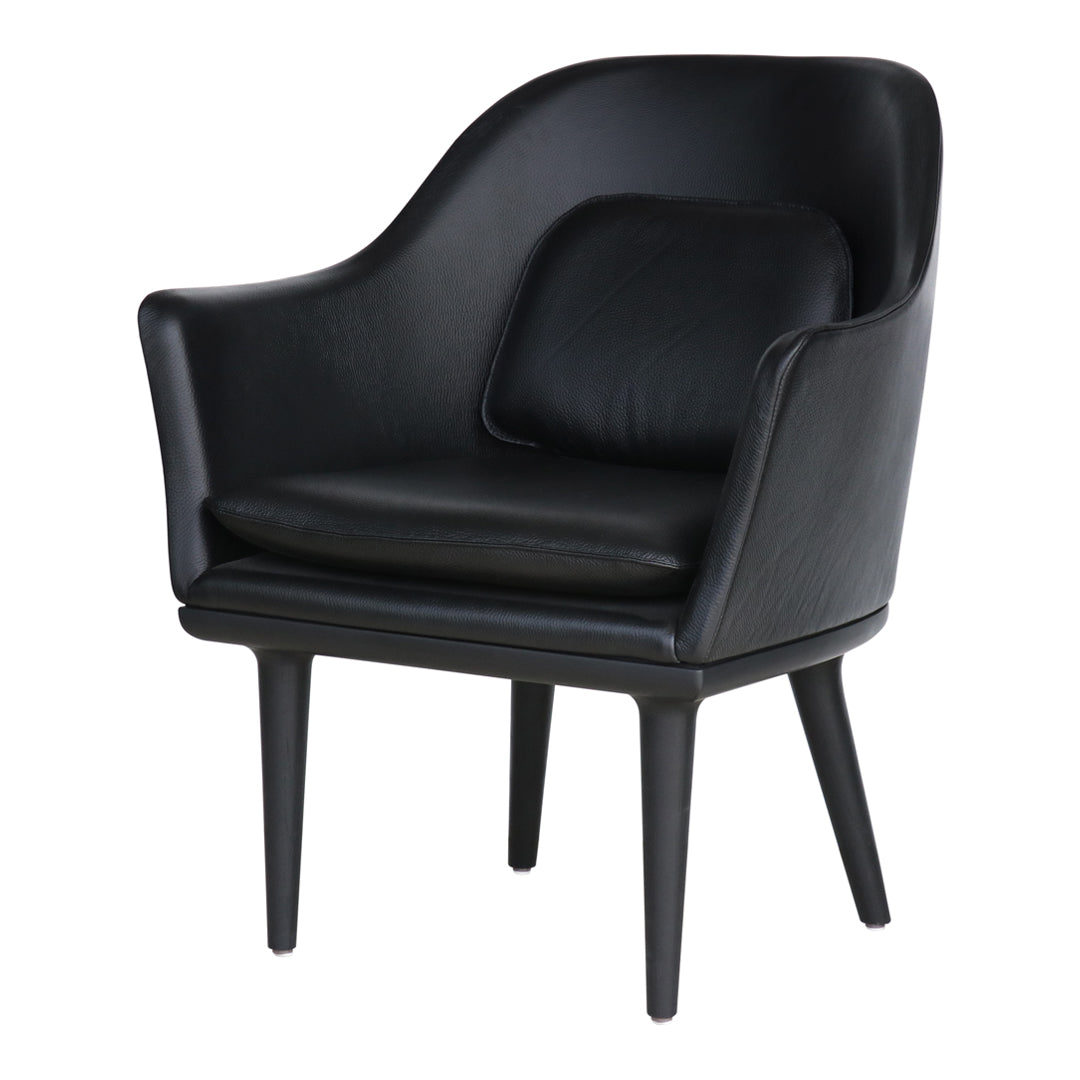 Elegant black leather armchair with smooth contours and minimalist design, featuring sleek black wooden legs.