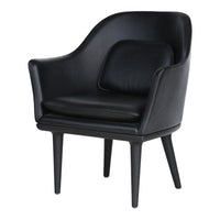 Elegant black leather armchair with smooth contours and minimalist design, featuring sleek black wooden legs.