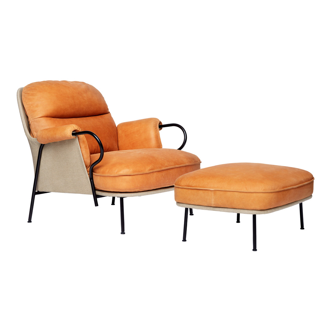 Orange and beige mid-century modern armchair and ottoman set with sleek black metal legs. Cozy, stylish upholstery.