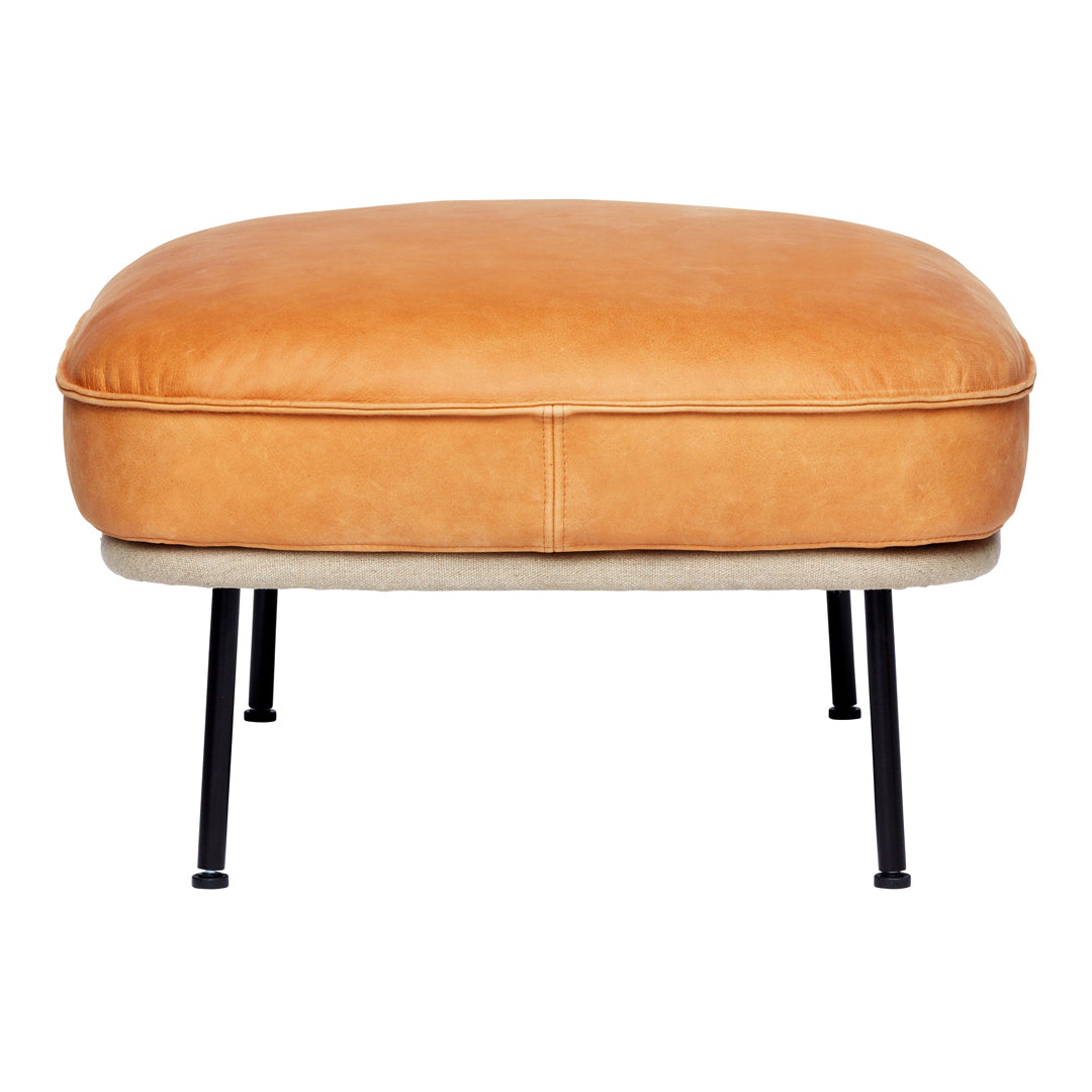 Tan leather ottoman with a smooth finish and contrasting light fabric base, set on black metal legs.