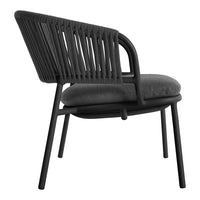 Stylish black lounge chair with sleek patterns and a padded gray seat for modern decor. Perfect for any living space.