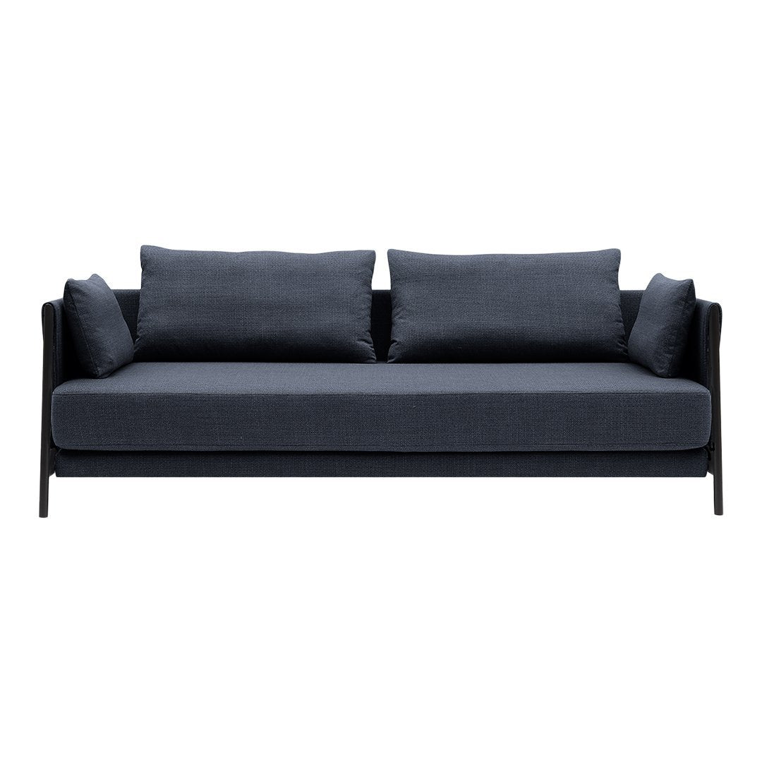 Sleek dark gray sofa with minimalist design and plush cushions, perfect for modern interiors.