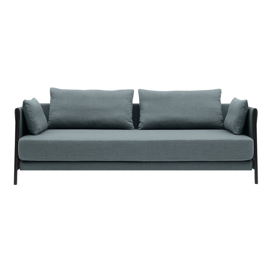 Modern three-seat sofa in soft blue-gray fabric with black armrests and matching cushions. Elegant and minimalist design.