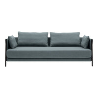 Modern three-seat sofa in soft blue-gray fabric with black armrests and matching cushions. Elegant and minimalist design.