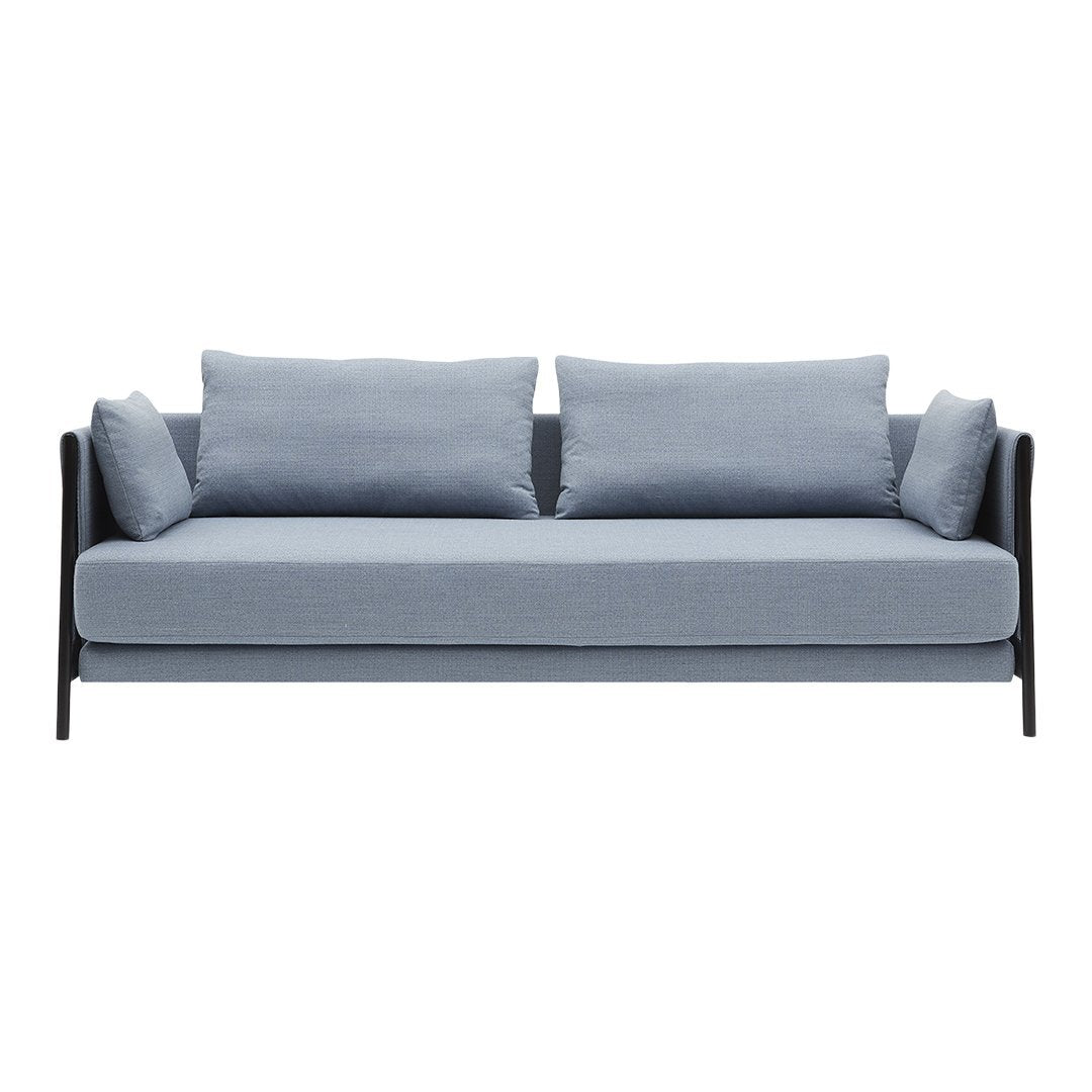 Gray upholstered sofa with two matching cushions, featuring a sleek black frame for a modern touch.