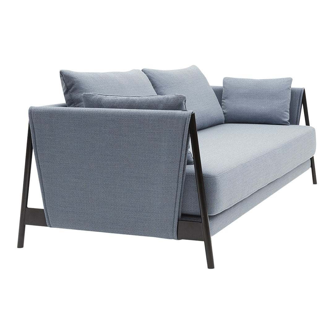 Light blue fabric sofa with black metal legs and removable cushions, featuring a sleek, modern design.