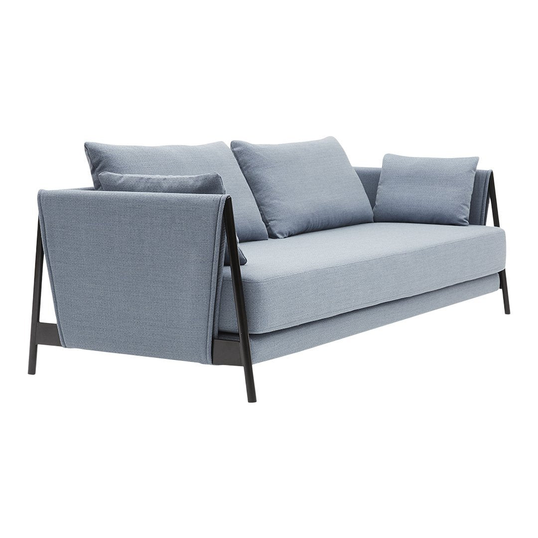 Light blue fabric sofa with smooth texture and black metal accents, featuring clean lines and minimalist design.