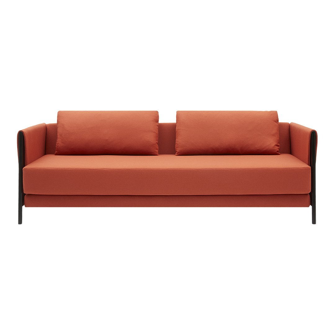 Modern orange sofa with clean lines and two complementing cushions, perfect for contemporary decor.